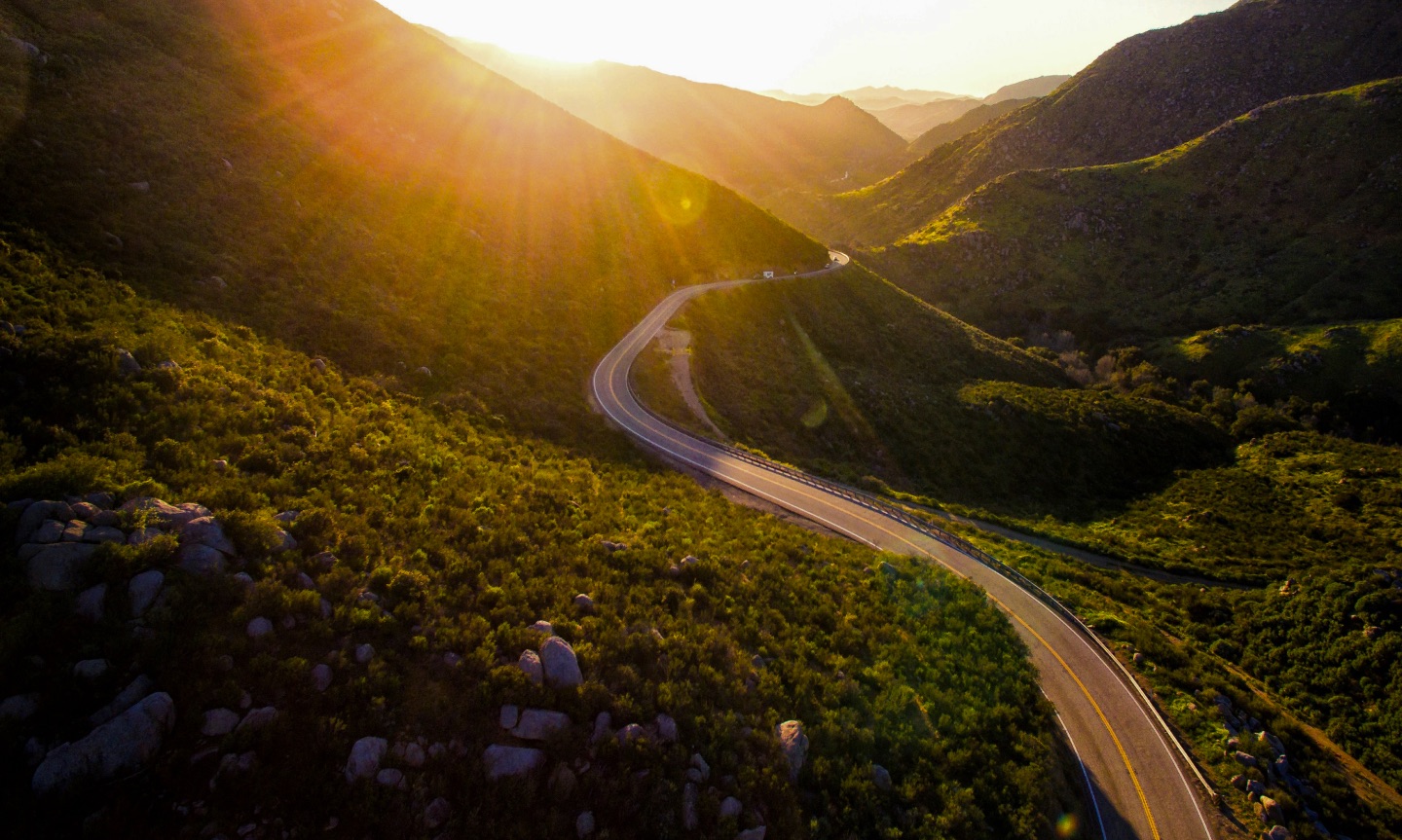 Winding road into sunset