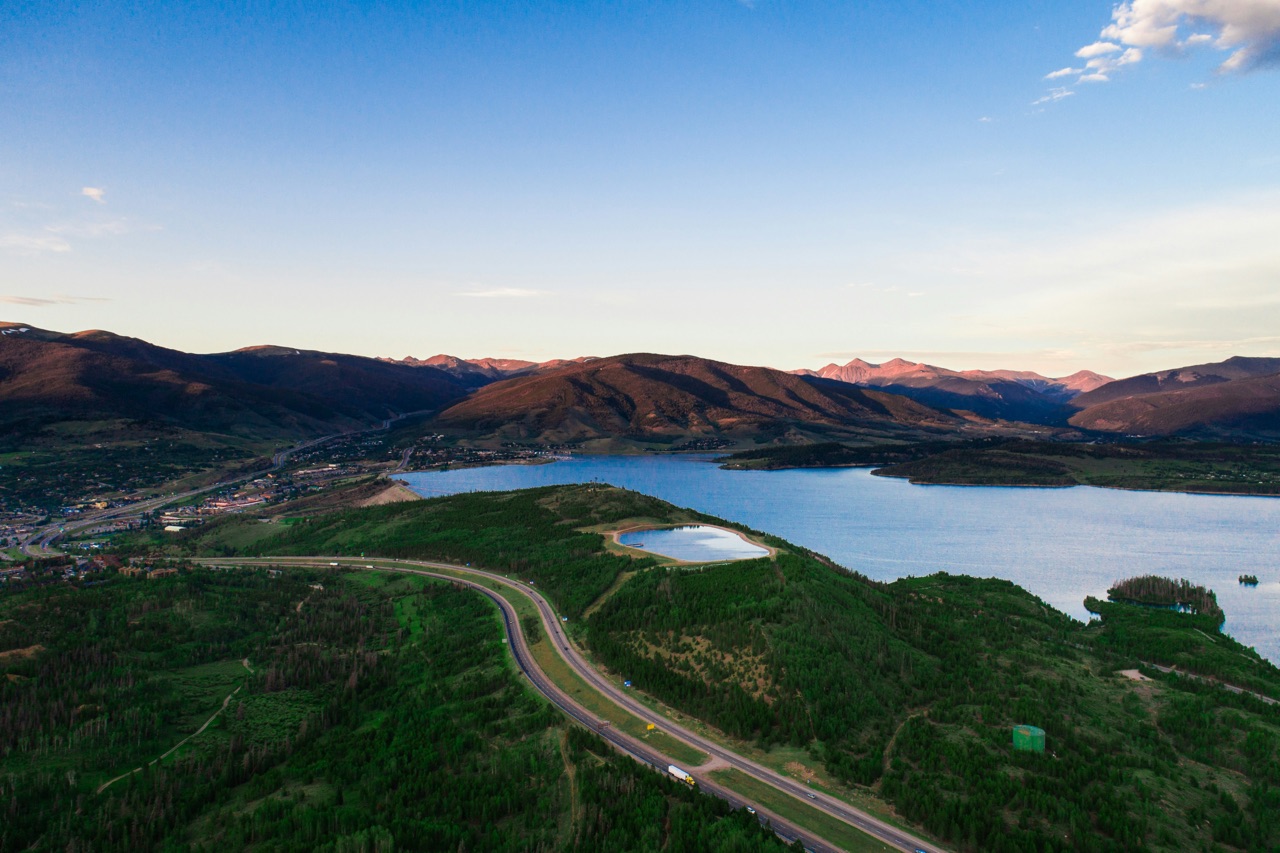 Winding road near forest and lake